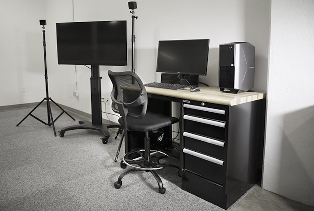 AR/VR work station with monitors, desk, and other equipment